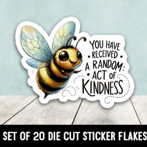 May include: A set of 20 die-cut sticker flakes featuring a cartoon bee with the text "You have received a random act of kindness".