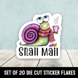 May include: A die-cut sticker featuring a cartoon snail with a purple and pink shell, wearing a scarf and holding a pink coffee cup. The sticker has the words "Snail Mail" and is on a white background.