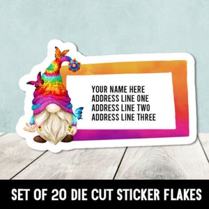 May include: A set of 20 die-cut sticker flakes featuring a colorful gnome with a rainbow tie-dye hat and butterflies. The stickers have a blank space for personalization with the text "YOUR NAME HERE ADDRESS LINE ONE ADDRESS LINE TWO ADDRESS LINE THREE".