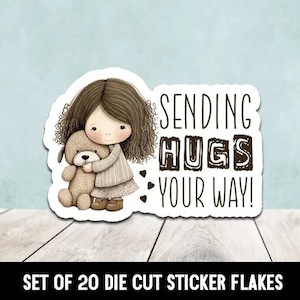 May include: A set of 20 die cut sticker flakes featuring a cartoon girl hugging a teddy bear. The sticker says "Sending Hugs Your Way!"