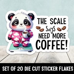 May include: A die-cut sticker featuring a cartoon panda wearing pink pajamas and holding a cup of coffee. The panda is standing on a scale that reads "The Scale Says Need More Coffee!"