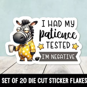 May include: A set of 20 die-cut sticker flakes featuring a cartoon zebra in pajamas holding a cup of coffee. The sticker says "I had my patience tested. I'm negative."
