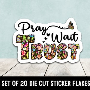 May include: A set of 20 die-cut sticker flakes with a floral design and the text "Pray Wait Trust" in black lettering. The stickers feature a butterfly and hearts.