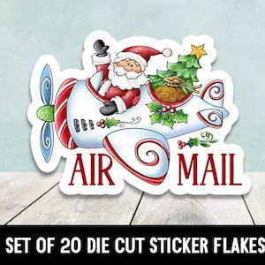 May include: A set of 20 die-cut sticker flakes featuring a cartoon Santa Claus flying a red and white airplane with a Christmas tree and a bag of gifts. The airplane has the words "AIR MAIL" on it.