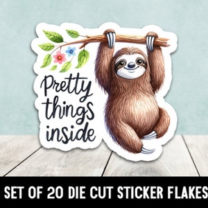 May include: A die-cut sticker featuring a smiling sloth hanging from a branch with leaves and flowers. The sticker has the text "Pretty things inside". The bottom of the sticker reads "SET OF 20 DIE CUT STICKER FLAKES".