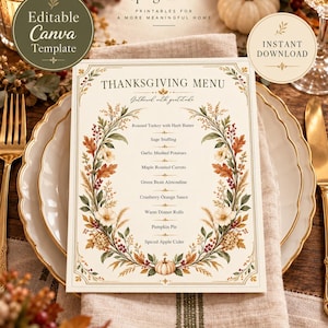 May include: A Thanksgiving menu card featuring a cream background with a decorative wreath of autumn leaves, berries, and a small pumpkin. The text reads Thanksgiving Menu, Gathered with gratitude, and lists traditional holiday food items.