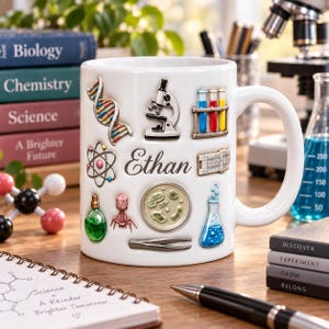 May include: A white ceramic mug featuring the name Ethan in script font surrounded by colourful science-themed illustrations including a DNA strand, microscope, test tubes, atom, petri dish, flask, and tweezers on a desk with science books.