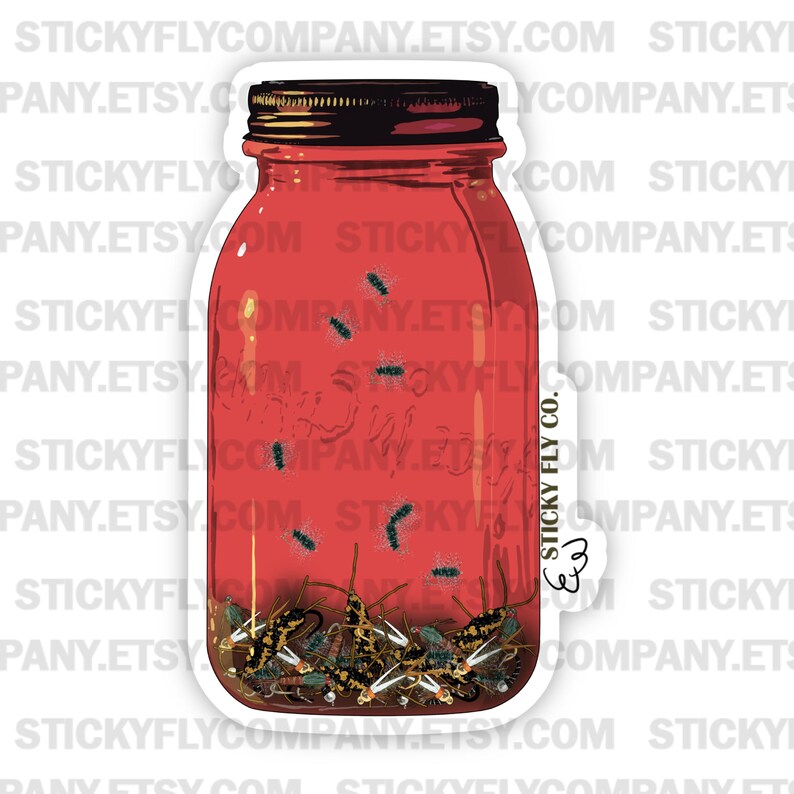 May include: A red glass jar with a black lid filled with a variety of colorful flies. The jar has a white label with the text "Sticky Fly Co." printed on it.