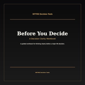 May include: A black workbook cover with gold text that reads INTYRE Decision Tools, Before You Decide, A Decision Clarity Workbook, and A guided workbook for thinking clearly before a major life decision. The cover features thin gold border lines.
