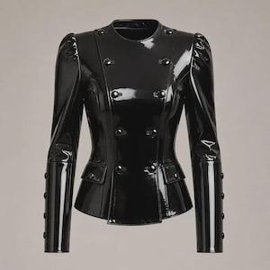 May include: A black patent leather jacket with a glossy finish, featuring a double-breasted front with eight buttons, a round neckline, long sleeves with four buttons on each cuff, and two small flap pockets at the waist.