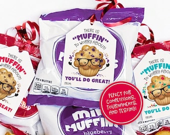 May include: Three printable gift tags with a cartoon muffin wearing glasses and the text "There is "muffin" to worry about!" You'll do great!"  The tags are on top of mini muffin bags. A red circle with the text "Perfect for competitions, tournaments, and testing!" is in the center of the image.