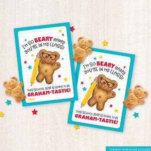 May include: Two printable gift tags featuring a cartoon bear wearing glasses and holding a pencil. The tags are blue with white lines and red and yellow stars. The text on the tags reads "I'm so beary happy you're in my class! This school year is going to be graham-tastic!"
