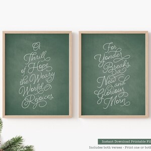 May include: Two framed prints with green backgrounds and white cursive text. The left print reads "A Thrill of Hope the Weary World Rejoices." The right print says "For Yonder Breaks a New and Glorious Morn."