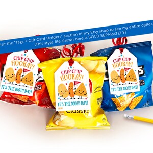 May include: Three bags of chips with colorful, printed gift tags attached. The tags feature a cartoon illustration of chips and the text "Chip Chip Hooray! It's the 100th Day!"