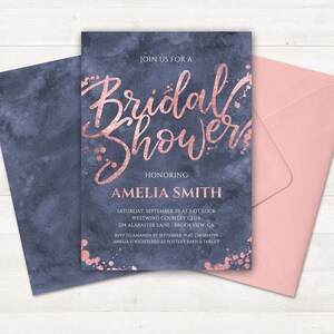 May include: A blue and rose gold bridal shower invitation with a watercolor background and gold glitter accents. The invitation reads "Join us for a Bridal Shower Honoring Amelia Smith" and includes the date, time, location, and RSVP information.