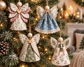 May include: Four fabric angel ornaments hanging on a Christmas tree. Each angel features a wooden bead head, fabric wings, and a cone-shaped dress with floral, gingham, or daisy patterns. They are suspended by twine loops and decorated with small wooden hearts or stars.