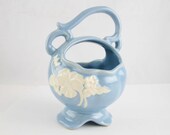 A 39 Weller 39 Pottery Basket - White Cameo on Baby Blue - Round Vase Basket With Detailed Handle - Marked on Bottom - Satin Glaze - Footed Base
