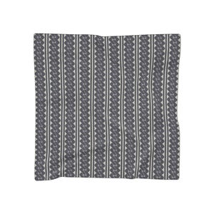 May include: A square scarf featuring a repeating vertical pattern of dark gray, interlocking geometric shapes separated by thin, light gray stripes. The design consists of alternating columns of textured, chain-like motifs and solid lines.