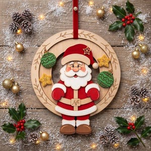 May include: A circular wooden Christmas ornament featuring a layered Santa Claus figure in the center, accented with green and yellow star and ball decorations, suspended by a red ribbon against a rustic wood background with pinecones.