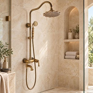 May include: A wall-mounted antique brass shower system featuring a large round rainfall showerhead, a handheld shower attachment with a flexible hose, and a dual-handle faucet mixer with decorative floral-inspired detailing on the knobs.