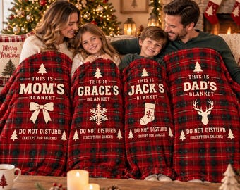 May include: Four matching red and black plaid blankets featuring white text and holiday icons. Each blanket displays the name Mom, Grace, Jack, or Dad, followed by the phrase This is [Name] Blanket and Do Not Disturb (Except for Snacks).