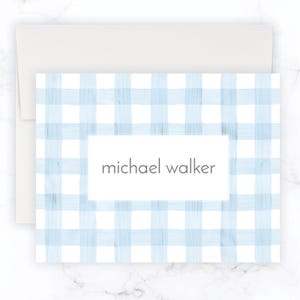 May include: A blue and white gingham patterned stationery card with the name "michael walker" printed in a white rectangle.