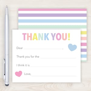 a colorful "Thank you!" card with a heart symbol, a pen, and a striped background.