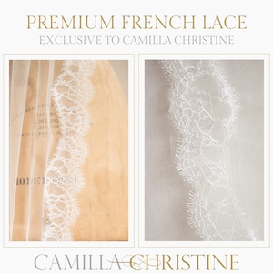 May include: White bridal veil with a delicate French lace trim. The lace features a floral pattern. The veil is sheer and lightweight.