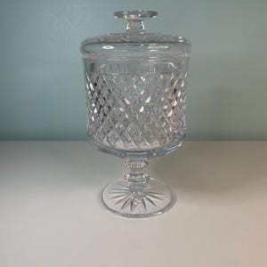 Antique crystal cur jar features a classic diamond cut