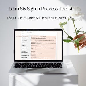 May include: A silver laptop displaying a Project Charter document from a Lean Six Sigma Process Toolkit. The screen shows text fields for project name, problem statement, and goals. The text "Lean Six Sigma Process Toolkit" and "EXCEL + POWERPOINT + INSTANT DOWNLOAD" appear above the laptop.