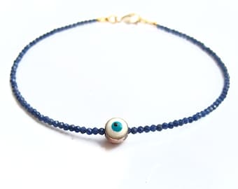 14 K solid yellow gold  evil eye beads bracelet  blue sapphire gemstone