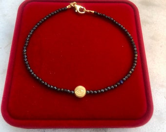 14 k yellow Gold evil eye bead black rhodium beads bracelet