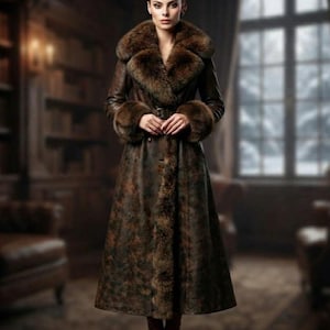 May include: A long, dark brown leather coat featuring a thick, plush fur collar and matching fur cuffs. The coat has a button-front closure, a belted waist, and a full-length silhouette with fur trim running down the center front opening.