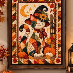 May include: A framed fabric wall hanging featuring a patchwork cat wearing a witch hat and a bow tie. The cat is surrounded by autumn leaves, pumpkins, a crescent moon, stars, and a lantern. The border consists of colourful geometric quilt blocks.