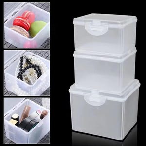 May include: A stack of three clear, rectangular plastic storage boxes with hinged lids and secure latch closures. The boxes are shown empty in the main view, while smaller inset images display them filled with macarons, jewelry, and cosmetics.