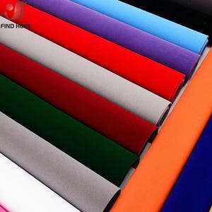 May include: A collection of fabric rolls in various colors including red, light blue, purple, grey, dark green, orange, and white. The rolls are arranged in parallel rows, displaying a smooth, matte texture. The text FIND HOPE is visible.
