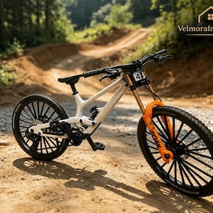 May include: A white mountain bike with a black seat, black handlebars, and black multi-spoke wheels. The front suspension fork is bright orange with black lettering. A small white number plate with the number 41 is attached to the front handlebars.