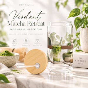 May include: A 16oz clear glass sipper cup featuring a printed design of a matcha drink, a bamboo lid with a straw hole, and a clear glass straw. The text on the cup reads CSP Atelier, Verdant Matcha Retreat, 16oz glass sipper cup, bamboo lid, and clear straw included.