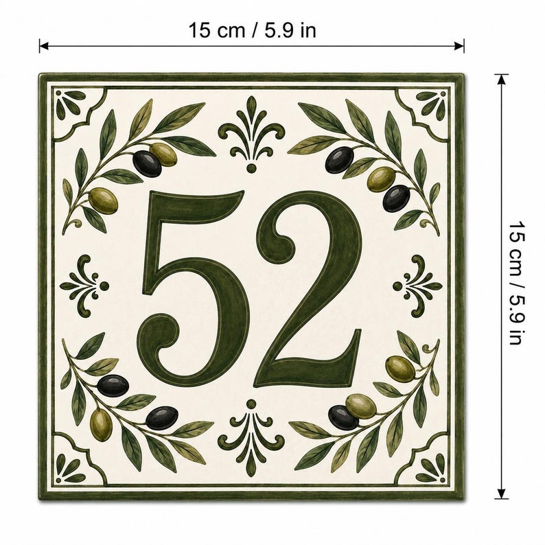 May include: A square ceramic house number tile featuring the number 52 in dark green. The design includes olive branches with black and green olives on a cream background, framed by a dark green border. It measures 5.9 inches by 5.9 inches.