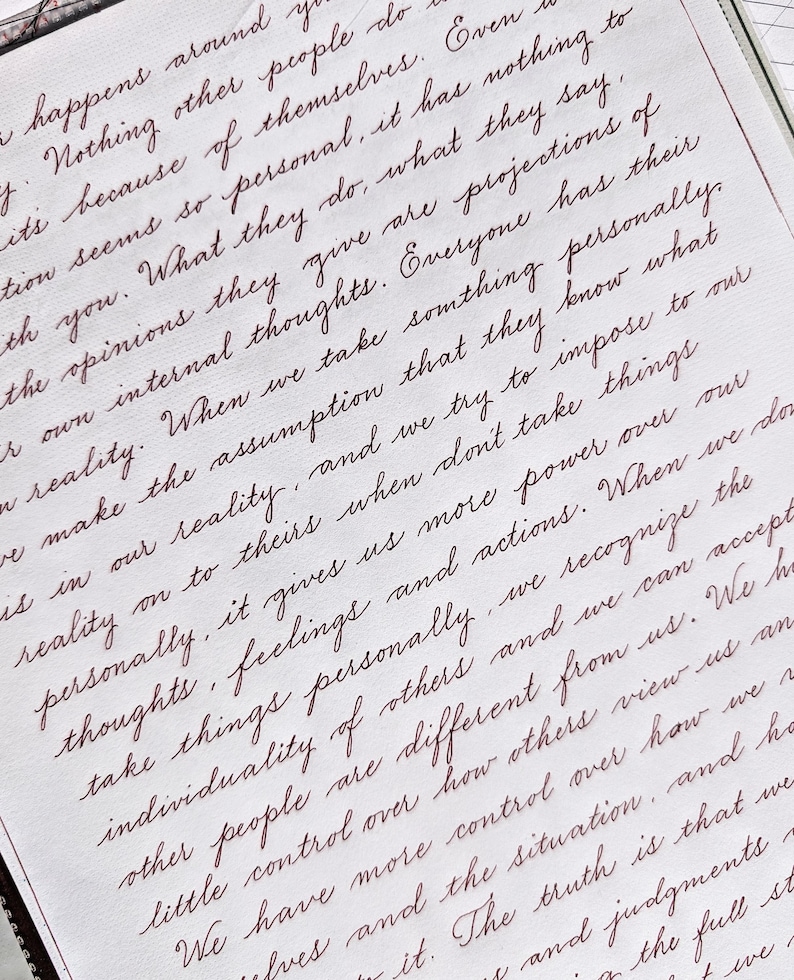 May include: A page of white paper featuring handwritten text in dark red ink. The script is written in a flowing, cursive style, filling the page with multiple lines of English text that discuss personal perceptions, opinions, and individual reality.