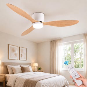 May include: A ceiling fan with three light-coloured wood grain blades and a central white cylindrical housing featuring an integrated circular LED light. A white handheld remote control with multiple buttons is shown in the foreground.