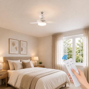 May include: A white ceiling fan with integrated LED lighting and three blades, featuring a central light fixture. The fan is controlled by a handheld white remote control with circular buttons, including a power icon and numbered speed settings.