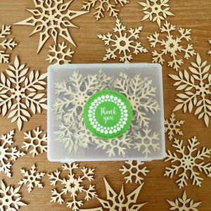 25 fine quality laser cut wood snowflakes in a reusable plastic box,   1 1/4 to 3 1/2 inches wide for crafting, scrapbooking, holiday decor