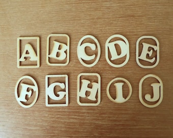 One of 26 laser cut wood letter pieces A-Z in reusable plastic box. For crafting, scrapbooking, labeling or play.