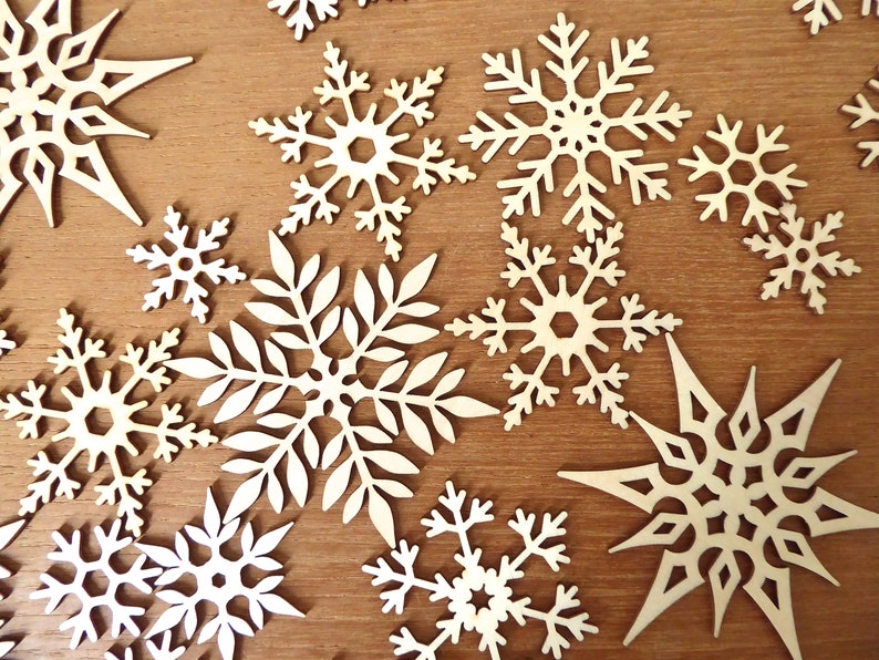 18 1 3/4 inch fine laser cut wood snowflakes for crafting in various patterns fancy cut wood snowflakes