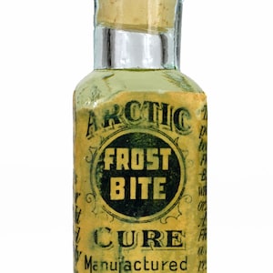 May include: A small glass bottle with a cork stopper. The label is yellowed and reads "Arctic Frost Bite Cure, Manufactured by Arctic Chemical Company, Chillicothe, Ohio."
