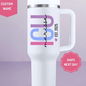 May include: White stainless steel travel mug with a pink, blue, and purple "ICU" design and the text "marissa est. 2025" in cursive.