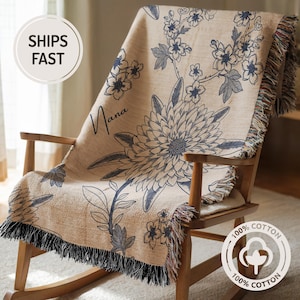 this beautiful cotton woven blanket for grandma with chinoiserie or toile navy blue floral design on 100 percent cotton is a unique customized gift for grandma. trendy and tasteful but cozy blanket for grandma, nana, gigi, meamaw, or mimi.