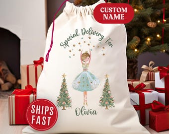 May include: A cream-colored Christmas gift bag with a ballerina illustration. The bag features the text "Special Delivery For" and a custom name. Two Christmas trees flank the ballerina. A red circle says "Ships Fast".