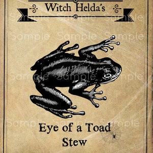 Puede incluir: Una ilustración de estilo vintage de un sapo con el texto "Witch Helda's Eye of a Toad Stew Brewed in Salem Since 1692" sobre un fondo marrón.